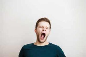 What Does It Mean When Someone Fakes Yawns While Talking To You